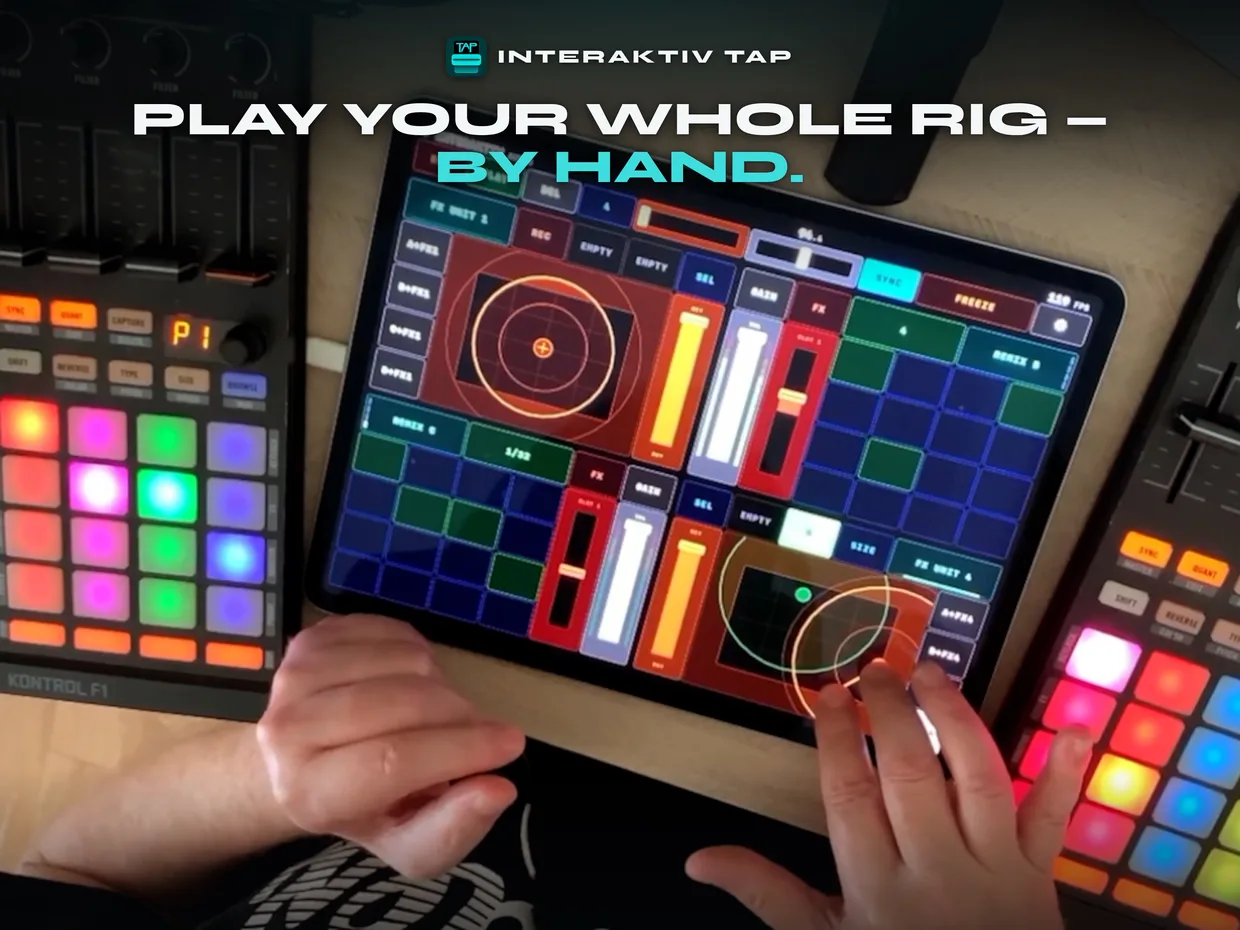 Pierantonio Gualtieri playing an iPad running Interaktiv Tap in his studio, on a desk between two Kontrol F1s, both hands on the glass — two fingers spread on an FX pad, two Remix deck cell grids and two FX pads across the four quadrants